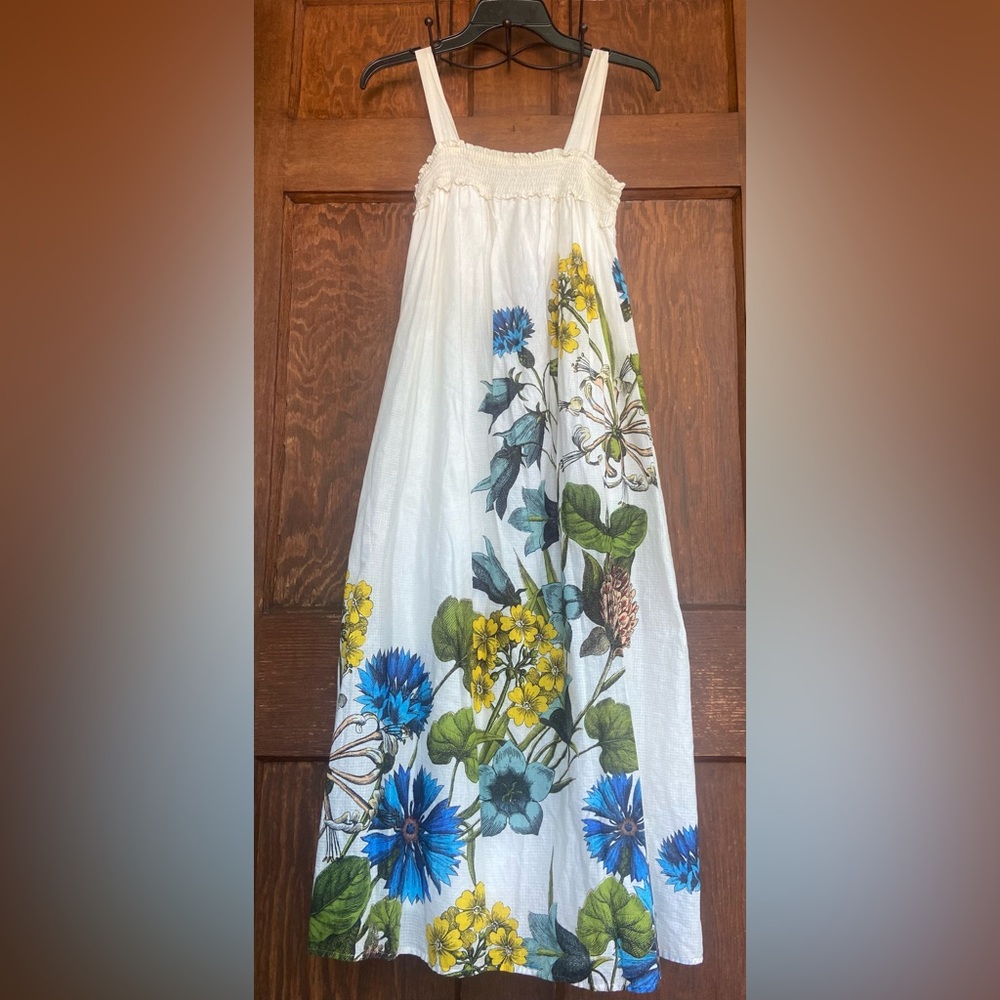 MAEVE Anthropologie White Maxi Dress with Blue and Yellow Floral Design.